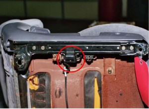 The "trigger" that prevented the seat from locking in the Gray vehicle